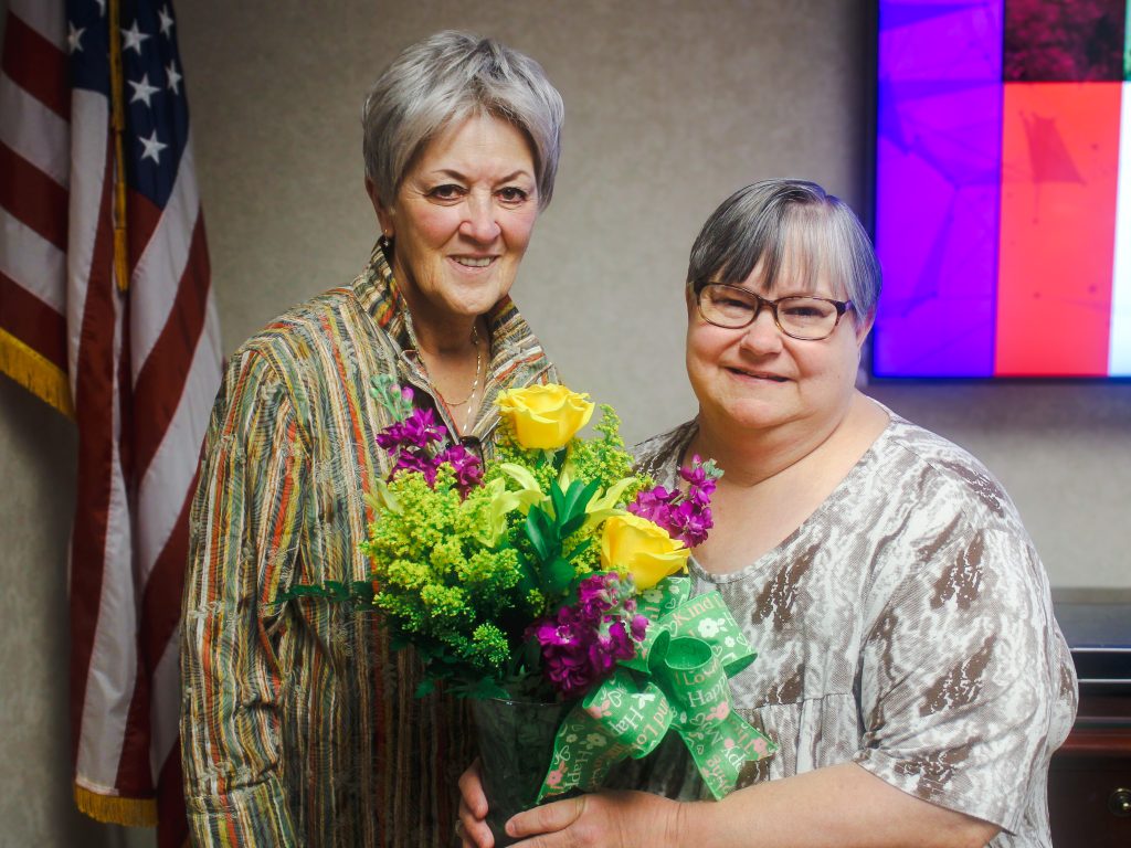 In this photo, Chair the SSC Board of Regents Marci Donaho (left) congratulates retired Associate Professor of Sociology Tracy Jacomo (right) on receiving emeritus status following the meeting on March 26.