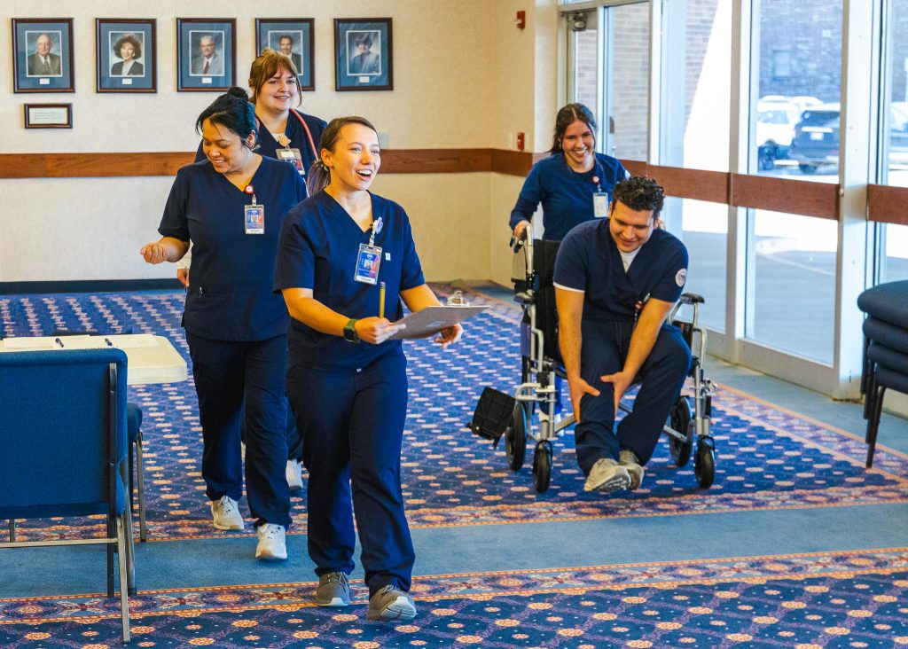 In this photo, several Seminole State College nursing students are shown in action as they participate in a simulation training event.
