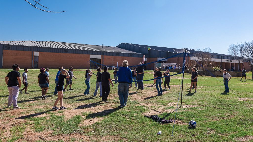 High school students play volleyball in Cook Commons on the SSC campus between competitions during the Interscholastic Meet.