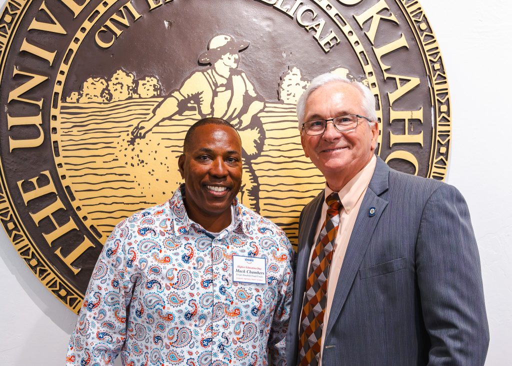 SSC Head Baseball Coach Mack Chambers greets SSC alumni and former Trojan baseball player Senator Darcy Jech at the event.