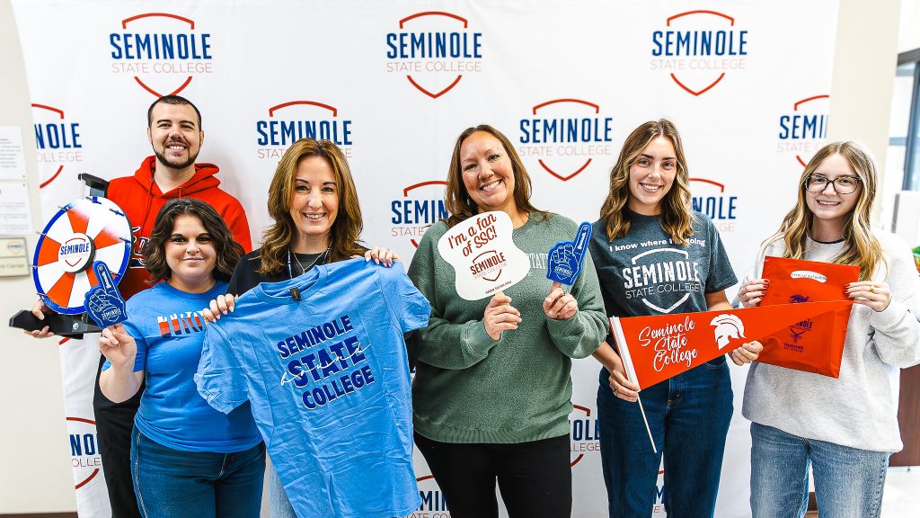 In this photo, Pictured, from left: Academic Advisor Davis Kappele, Student Support Services Advisor Megan Goff, Talent Search Advisor Leslie Havlicek, Financial Aid Specialist Alicia Ryan, Recruitment Specialist Maddy Potter and Financial Aid Specialist Lauryn Flewallen pose for a group photo.