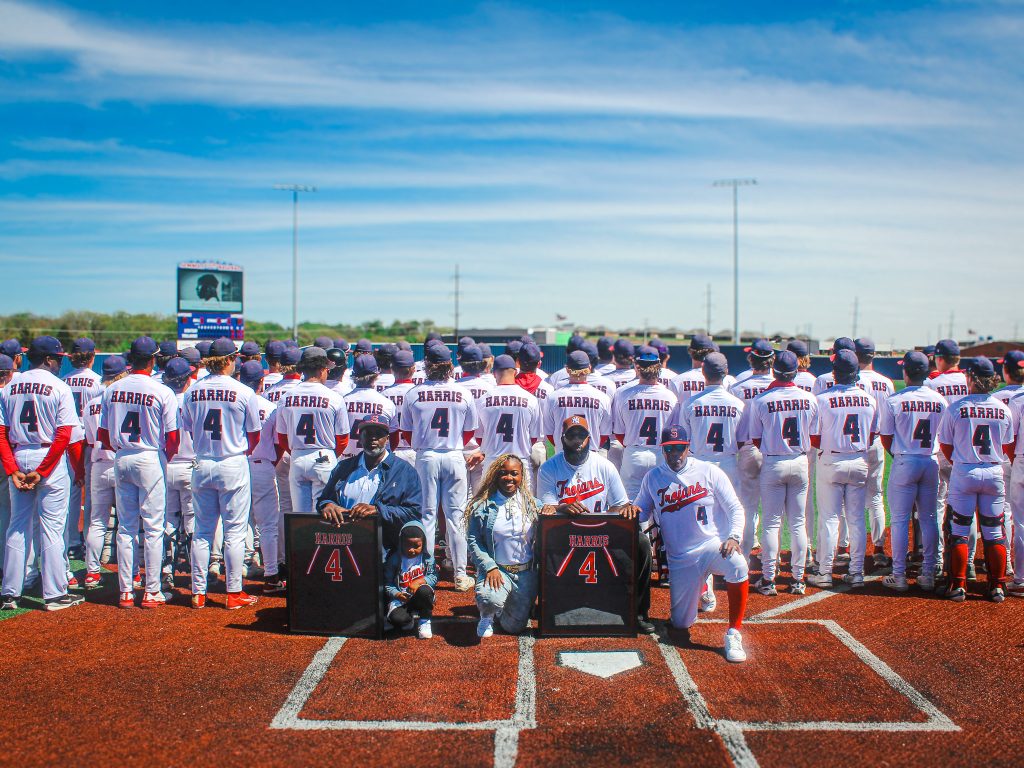 In this photo, SSC Head Baseball Coach Mack Chambers and members of the Seminole State College baseball team present Denim Harris’ parents, Toy Harper and David Harris, with a framed No. 4 jersey during a jersey retirement ceremony April 4 at Lloyd Simmons Field in the Brian Crawford Memorial Sports Complex.