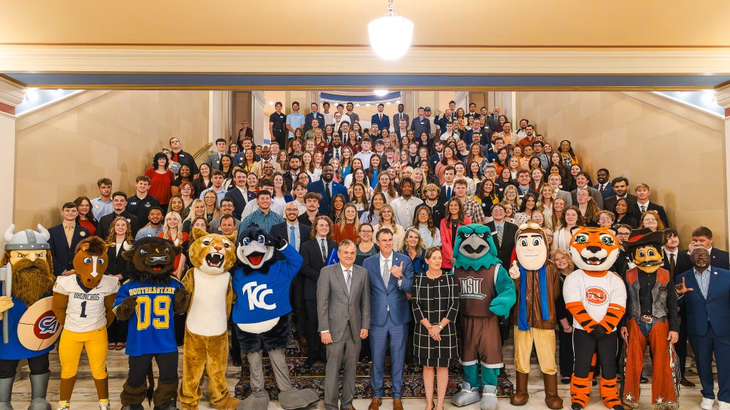 Group photo of college students with Governor Kevin Stitt at the Capitol