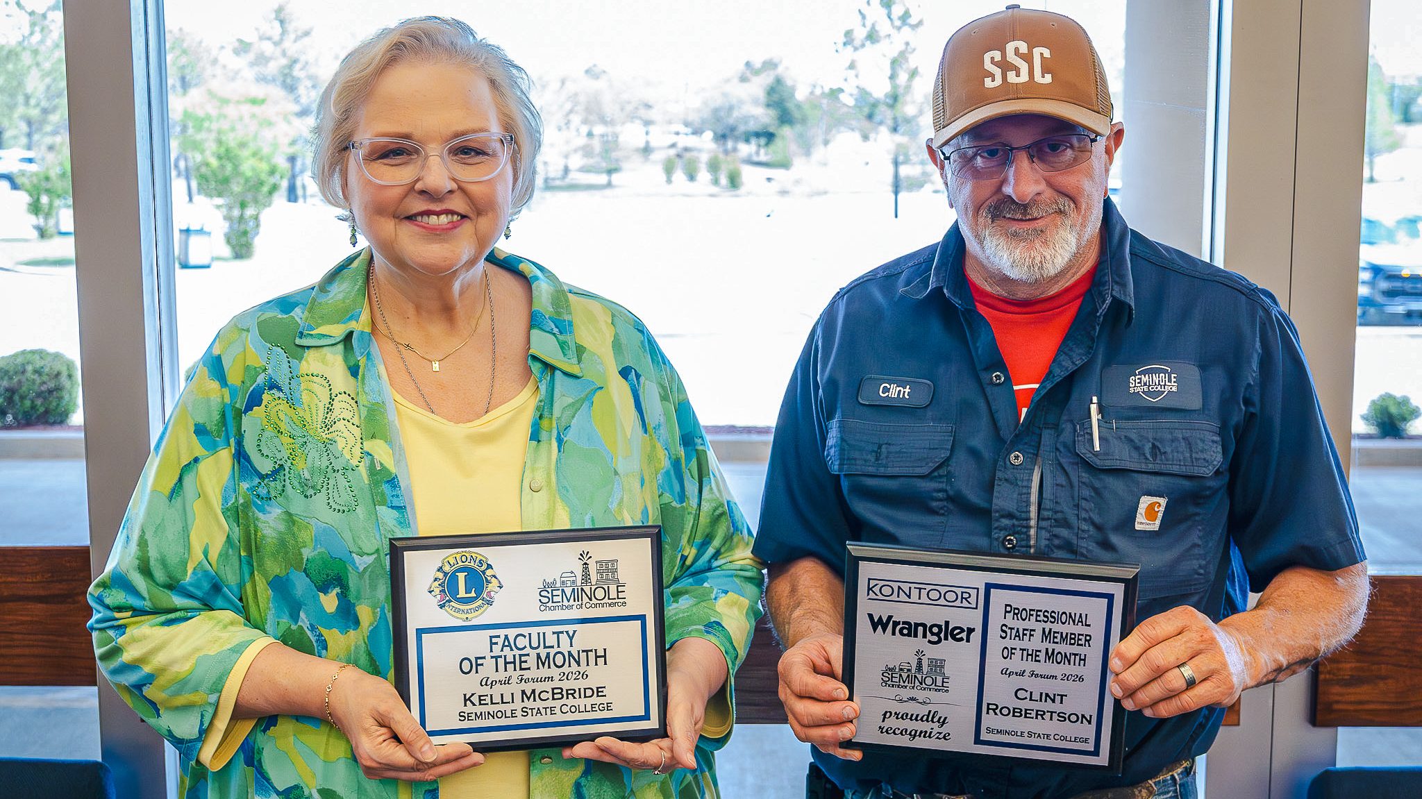 In this photo, Kelli McBride, Seminole State College Language Arts and Humanities Division Chair (left), and Clint Robertson, SSC Director of Physical Plant (right), pose for a photo holding their awards during the Seminole Chamber of Commerce Forum.