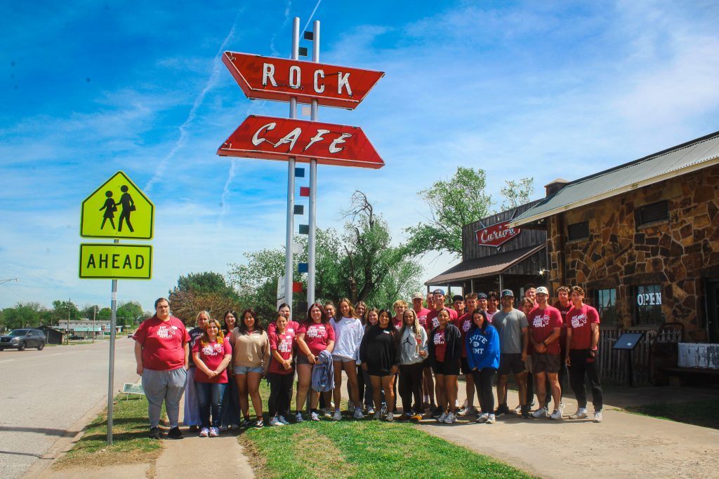 In this photo, SSC PLC students pose in front of the Rock Cafe in Stroud, OK.