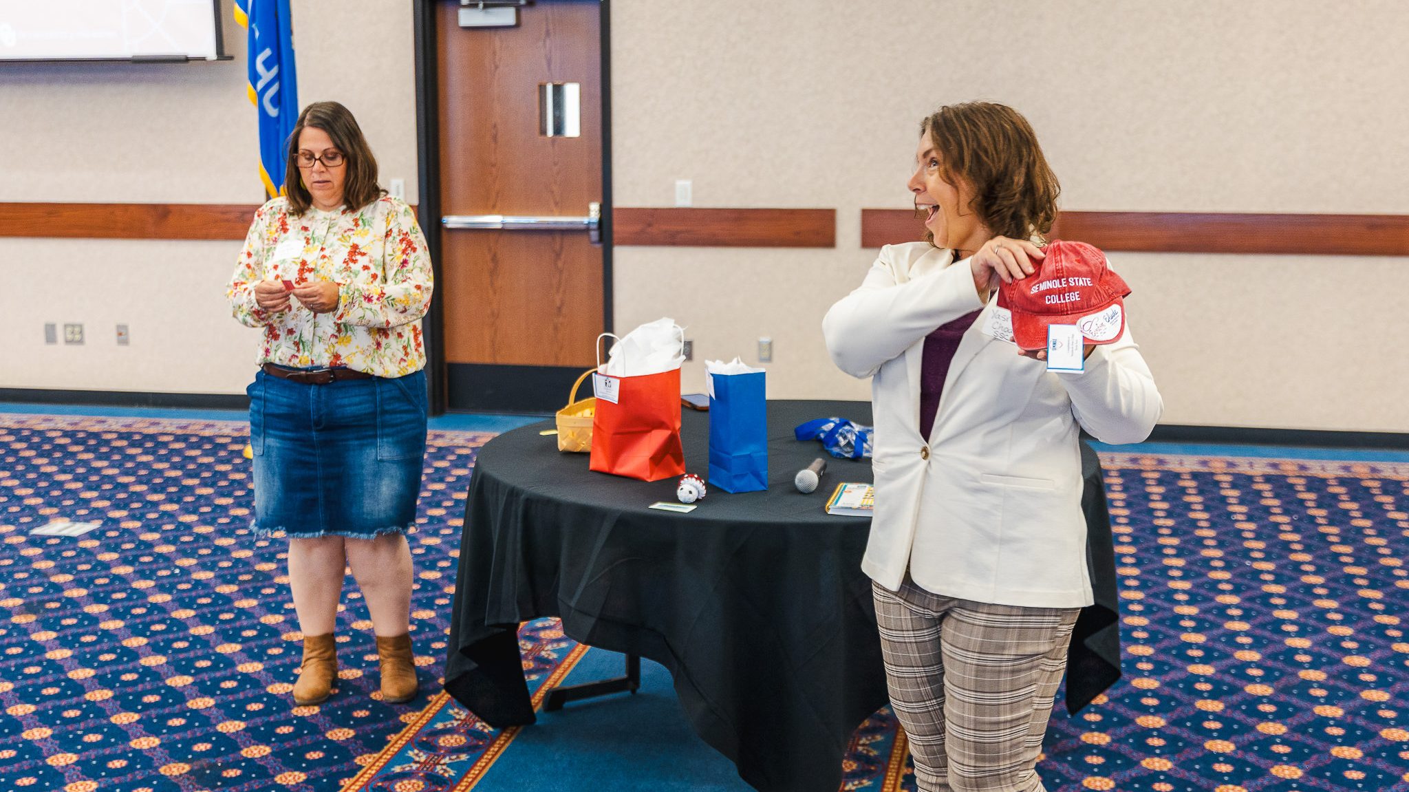 In this photo, SSC Assistant Professor of English Jamie Worthley (left) and Associate Professor of English Dr. Yasminda Choate (right) distribute raffle items during the NOSS-OK Spring Conference.
