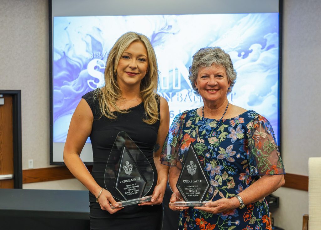 In this photo, Seminole State College Alumni Hall of Fame inductees Victoria Brooks (left) and Carole Carter (right) pose with their awards.