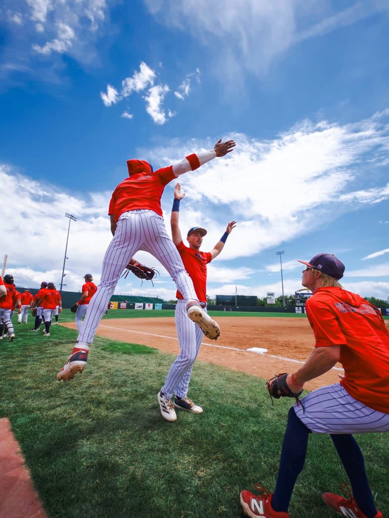 In this photo, Cohl McCoy of Fort Woth, Texas, left, and Dylan Restine of Panama, right, celebrate with Brayden Harpole of Burkburnett, Texas, center, during the JUCO World Series.