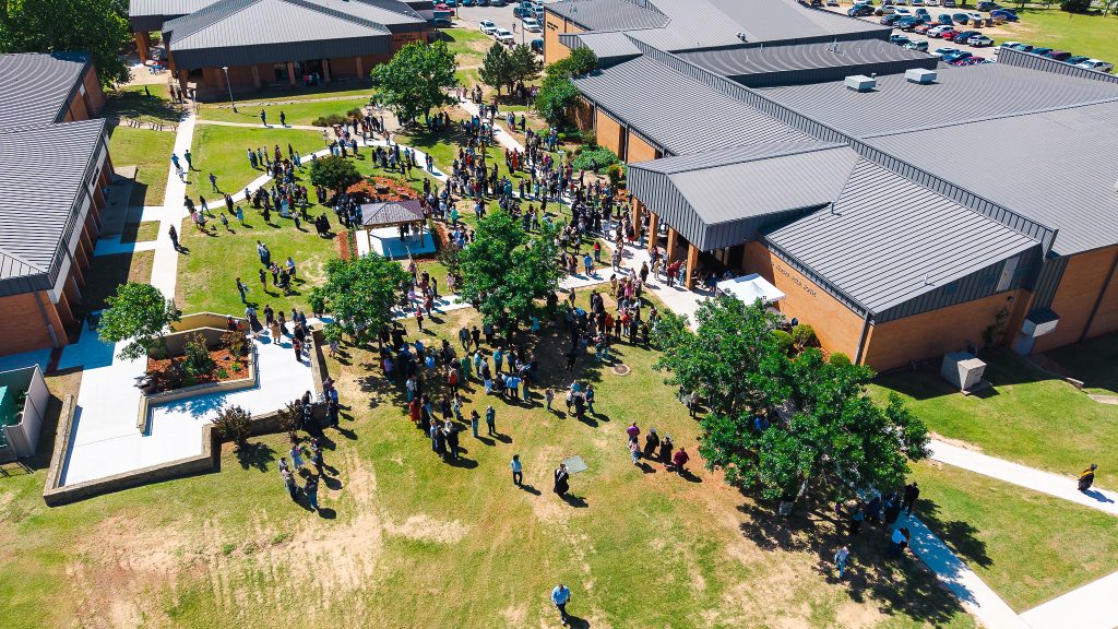 This photo shows an arial view of Families as they celebrate with graduates in Cook Commons on SSC’s campus following the ceremony.