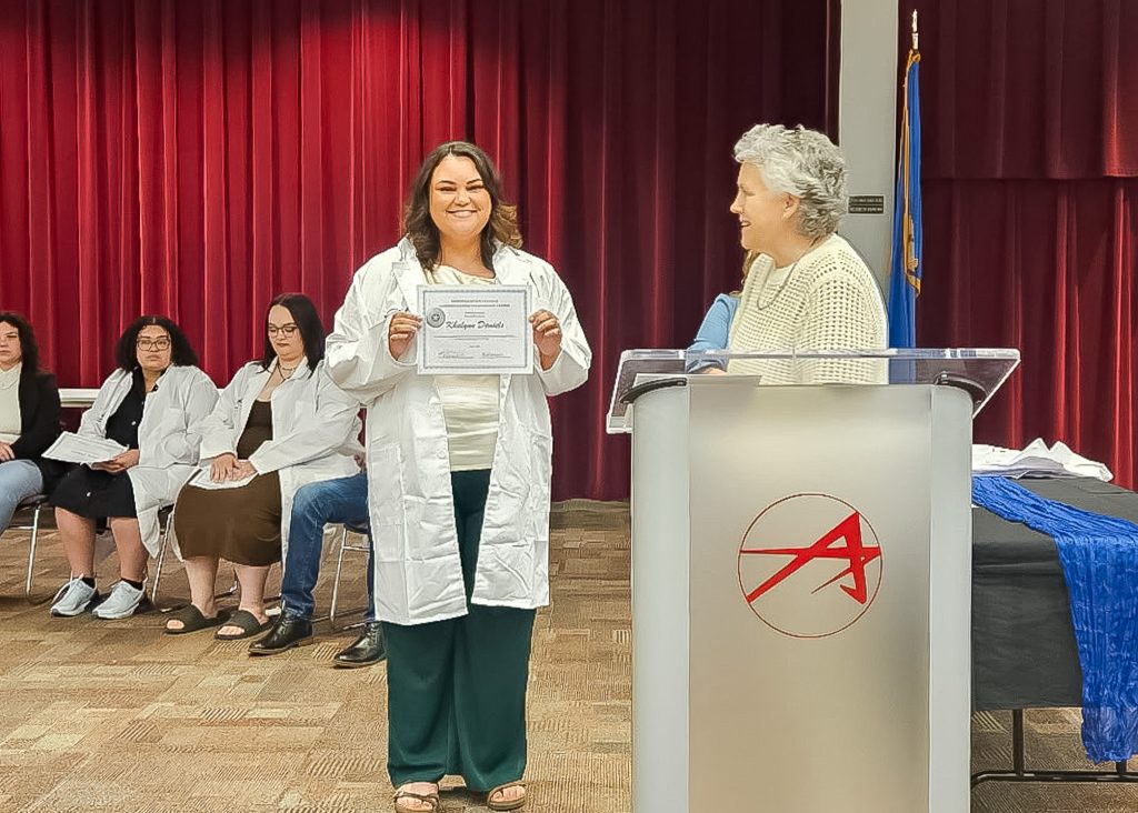 In this photo, Seminole State College Medical Laboratory Technology student Khalynn Daniels poses for a photo with MLT Program Director Kelly Hankle during the program’s White Coat Ceremony.