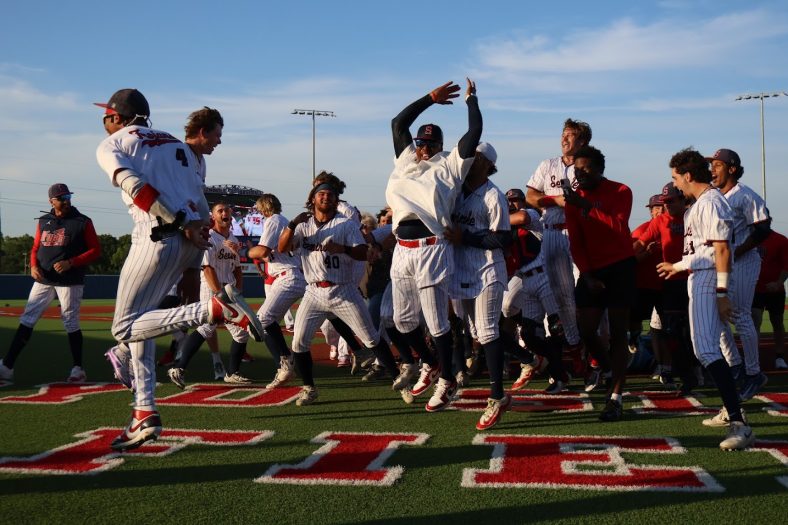 In this photo, the Seminole State College baseball team celebrates on the field after winning the district championship.