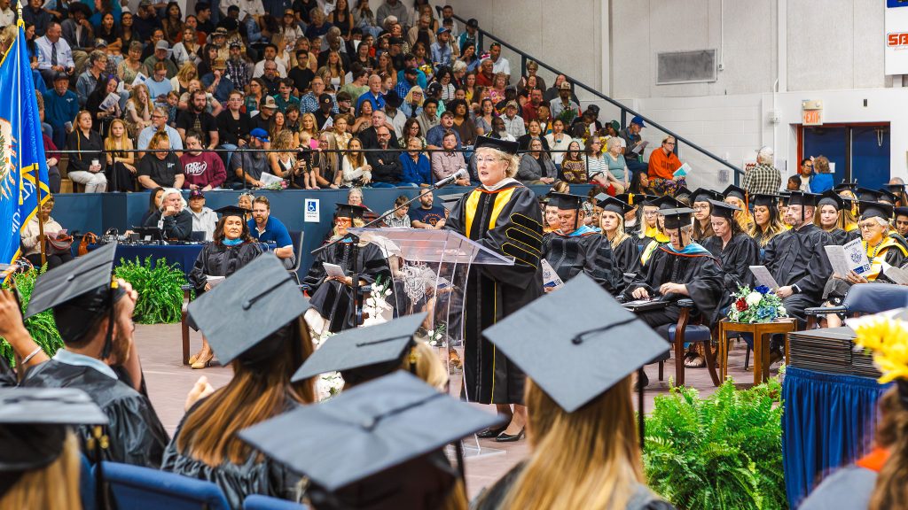 In this photo, SSC President Lana Reynolds welcomes graduates, families and guests during the ceremony in the Raymond Harber Field House.