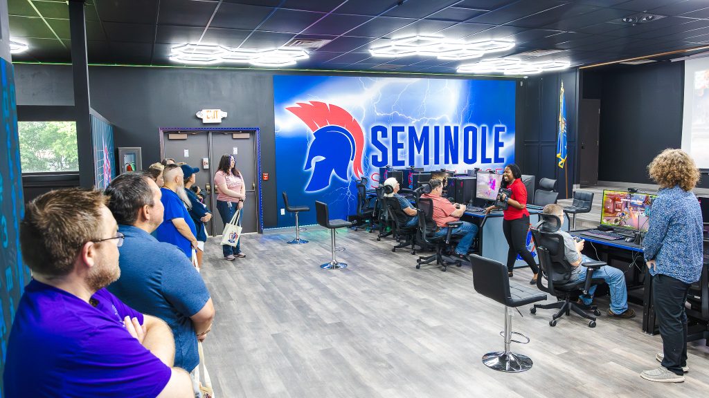 In this photo, SSC NASNTI Computer Science Specialist Alecia Bailey leads employees through the new Esports Lab, allowing them to sit at individual stations and learn about the high-tech devices available in the space.