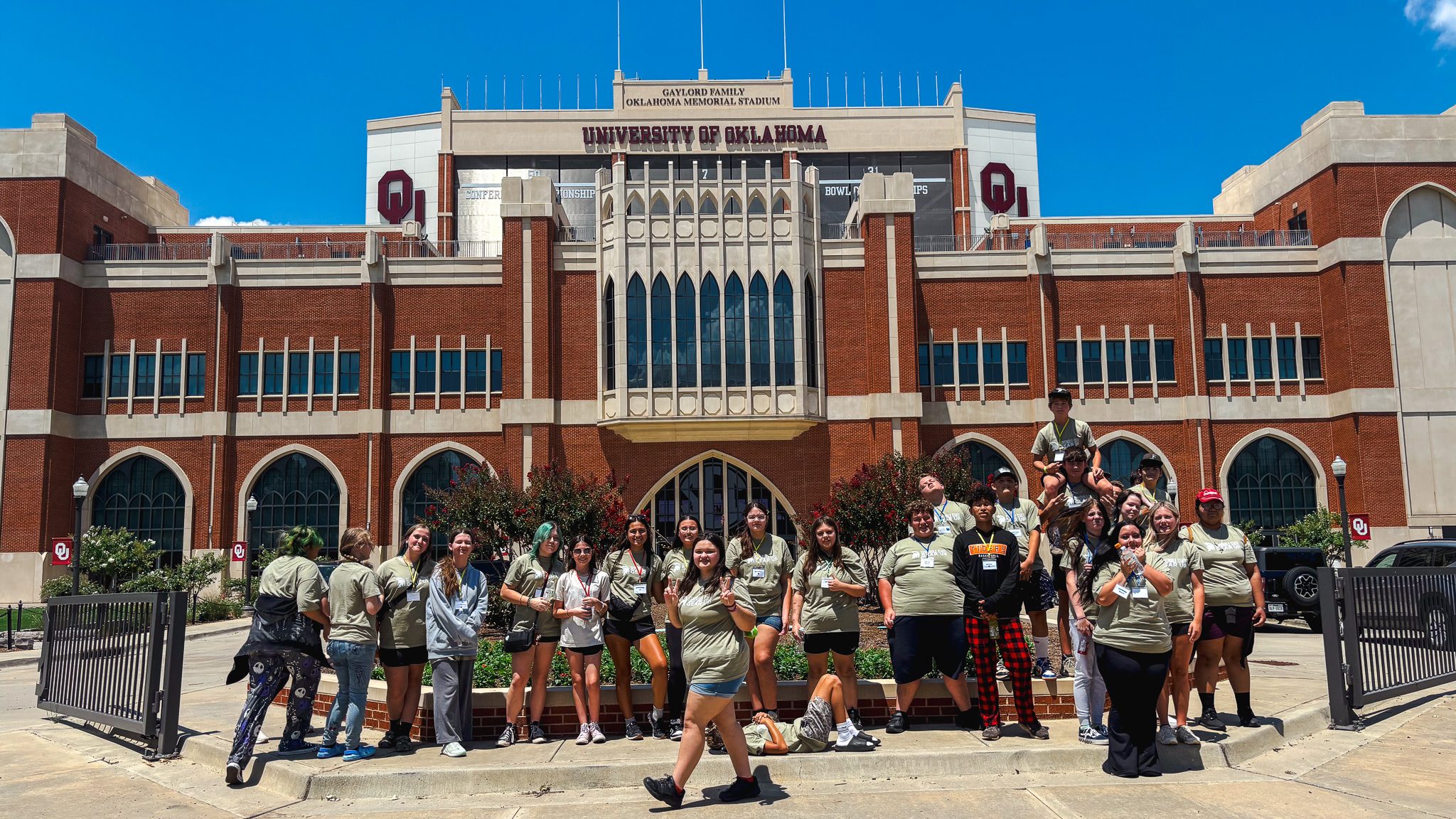 SSC GEAR UP students pose for a photo in front of Gaylord Family-Oklahoma Memorial Stadium during a tour of the University of Oklahoma campus.