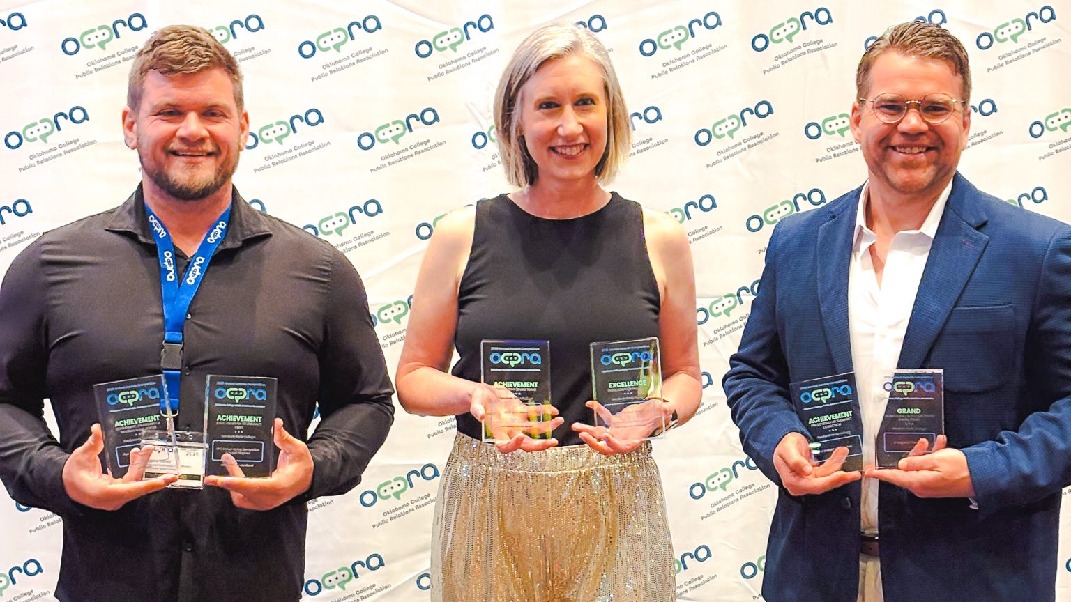 In this photo, Seminole State College Web and Multimedia Coordinator Brooks Nickell, Director of Community Relations Kim Pringle and Director of Communications Josh Hutton display the six awards earned by SSC’s Public Relations team following the Oklahoma College Public Relations Association Awards Ceremony on July 20 at Choctaw Casino & Resort in Durant.