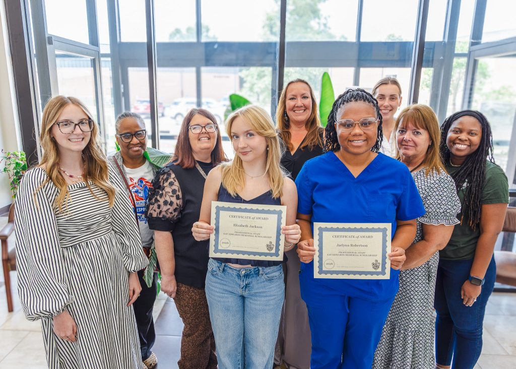 In this photo, posing for a group picture and listed left to right, are Financial Assistance Specialist Lauryn Flewallen, Director of NASNTI Kay Wallace, Director of Enrollment Management Edith Cathey, Jackson, Financial Aid Specialist Alicia Ryan, Robertson, Recruitment Specialist Maddie Potter, Registrar Sheila Morris and NASNTI Computer Science Specialist Alecia Bailey.
