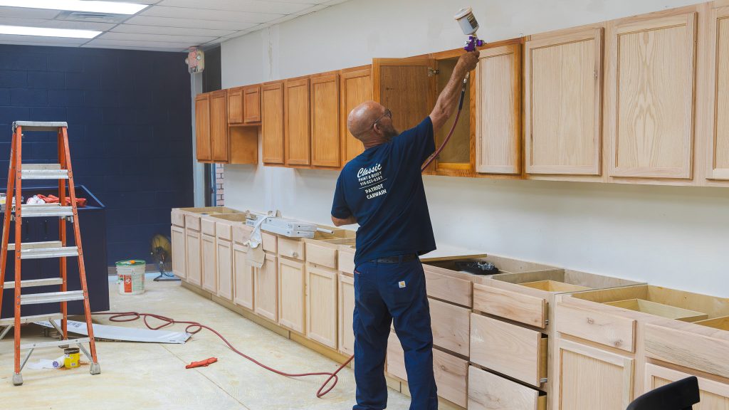 In this photo, Maintenance Technician Kevin Davidson installs new cabinets in Tanner Hall as Seminole State College completes campus improvements ahead of the fall semester. Classes begin Aug. 17.