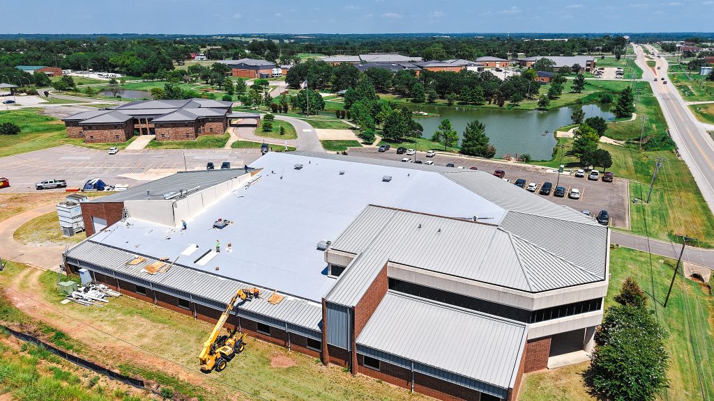 This photo is an ariel view of crews replacing the roof of the Enoch Kelly Haney Center.
