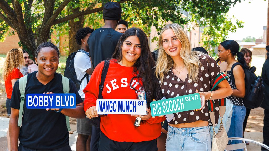In this photo, from left, SSC students Fredricka Finnikin of Montego Bay, Jamaica; Losaline Makahununiu of Norman; and Malerie Hawk of Choctaw show off custom street signs they created Aug. 17. The activity was one of several events hosted by SSC Student Activities and Events during Welcome Week.