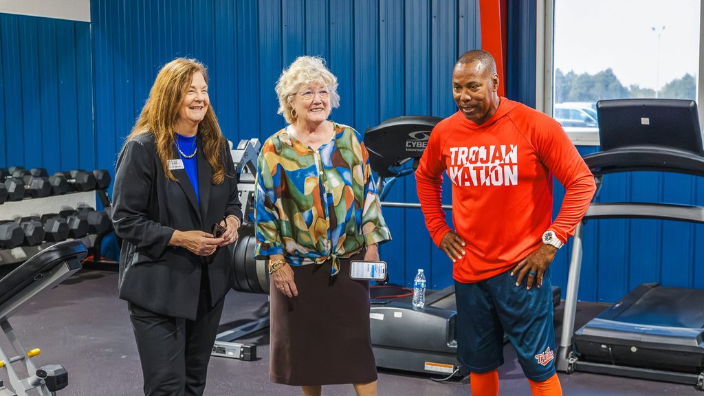 SSC Baseball Head Coach Mack Chambers (right) gives OACC Executive Director Dr. Cheryl Evans (left) a tour of the baseball team’s training facility at the BCM Sports Complex during her visit to campus. Also pictured is SSC President Lana Reynolds (center).
