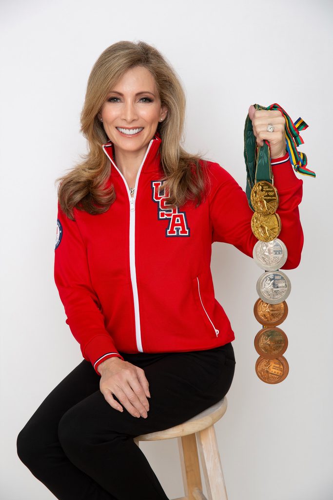 In this photo, Shannon Miller is shown holding her Olympic medals.