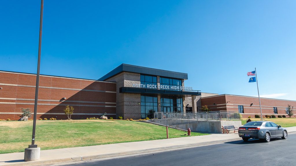 This photo shows the front of the North Rock creek Highschool building.