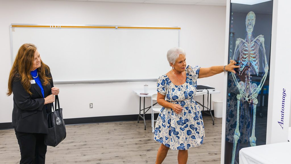 SSC Director of Nursing Ann Benson (right) demonstrates the College’s Anatomage Table for Oklahoma Association of Community Colleges Executive Director Dr. Cheryl Evans during her visit to campus.