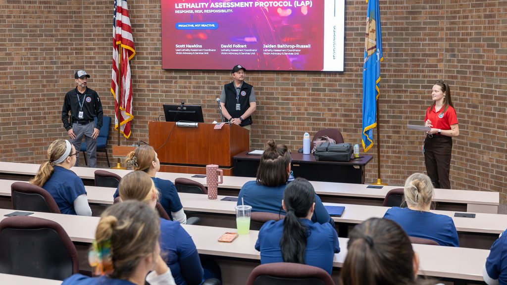 In this photo, Lethality Assessment Coordinators Scott Hawkins, David Folkert and Jaiden Balthrop-Russell speak to nursing students during an on campus training.