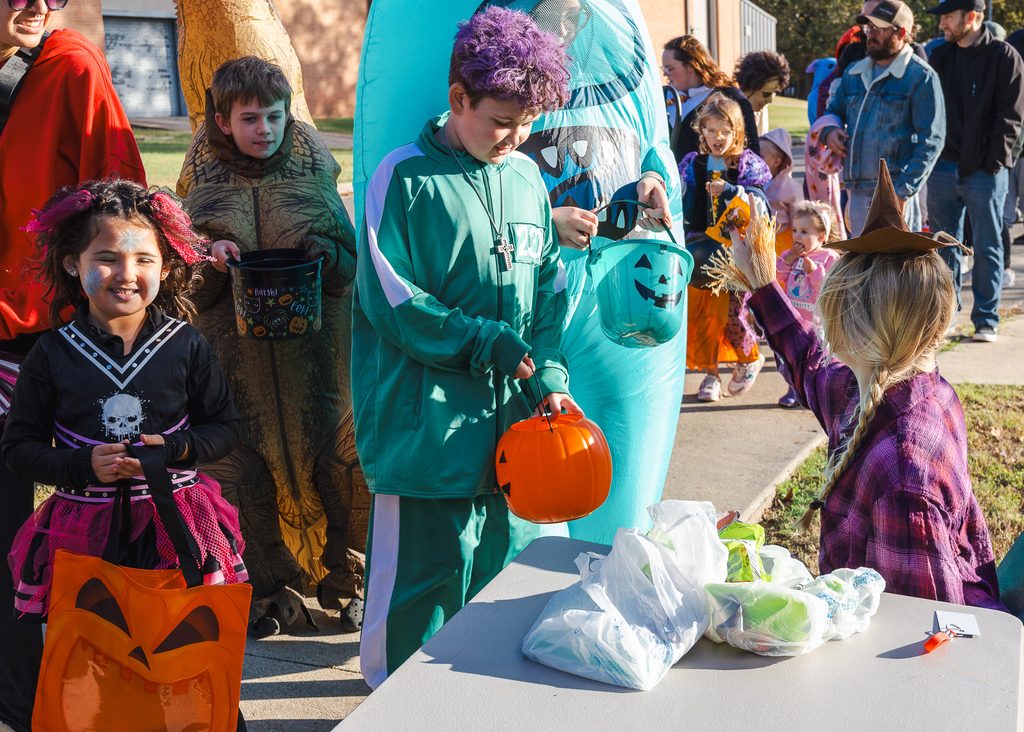 This photo shows children in their Halloween costumes as they participate in Trick or Treat Trail.